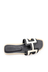 Black and white cowhide and canvas leather slippers